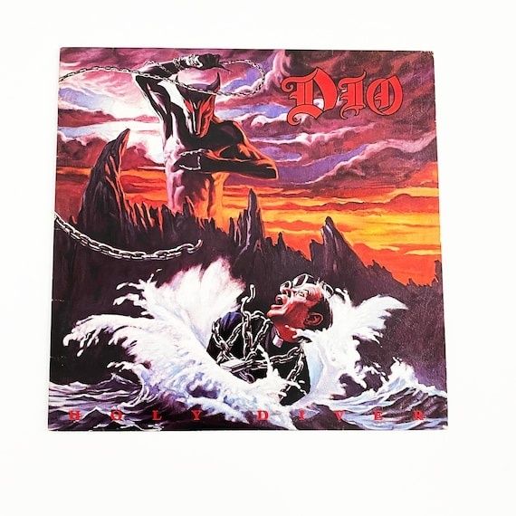 Heavy metal album artwork showing a chained figure battling crashing waves